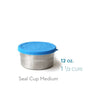 The EcoLunchBox Seal Cup Medium is a stainless steel container with a blue silicone lid, labeled “12 oz. 1 1/2 cups,” making it an ideal plastic-free lunchbox for meals on the go, shown on a white background.