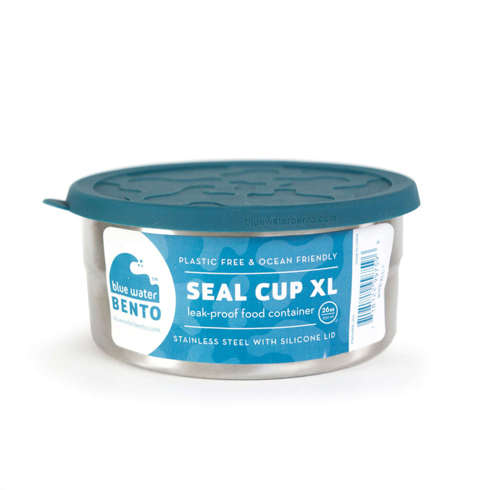 The EcoLunchBox Seal Cup XL is a stainless steel lunch box with a teal silicone lid. It’s plastic-free, ocean-friendly, and leak-proof—perfect for eco-conscious food storage.