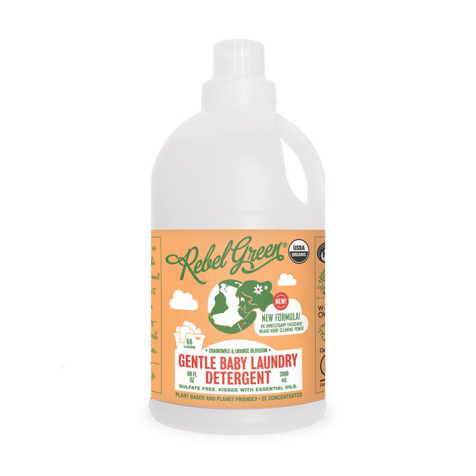 A bottle of Rebel Green Gentle Baby Laundry Detergent Liquid - 3x Concentrated with an orange label, green and white graphics, eco-friendly icons, and text highlighting its plant-based, sulfate-free USDA Certified organic formula.