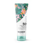 A tube of Badger Balm Daily Mineral Sunscreen - SPF 50 features a tropical leaf design and is made with 85% organic ingredients, offering water resistance for up to 40 minutes. This mineral sunscreen also works as a gentle moisturizer for sensitive skin and is reef-safe, providing ideal daily sun protection.