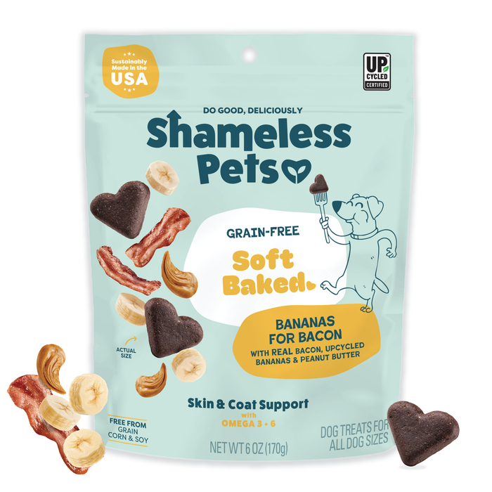 A bag of Shameless Pets Bananas for Bacon Soft-Baked Dog Treats with banana, bacon, and heart-shaped treat illustrations. These natural, grain-free treats support skin & coat health and use upcycled eco-friendly ingredients.