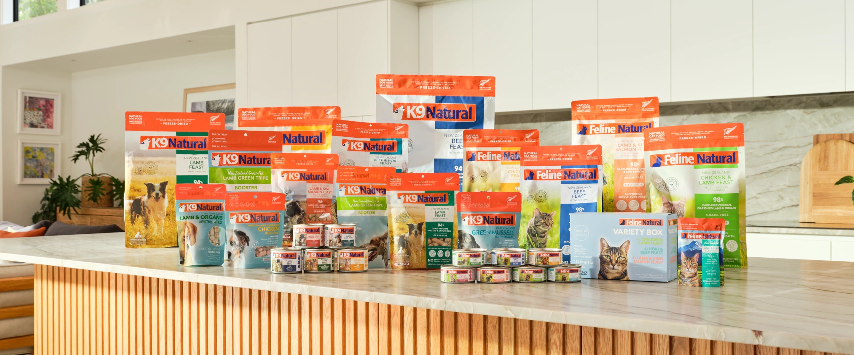 Assorted pet food packages on a counter in a store setting