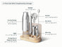 The Caraway Stainless Steel Complete Bar Set includes 9 essential tools—cocktail shaker, jigger, muddler, strainer, bar spoon, wine key, and more—all organized on a labeled wooden base. A stylish mixology kit for any home bar.