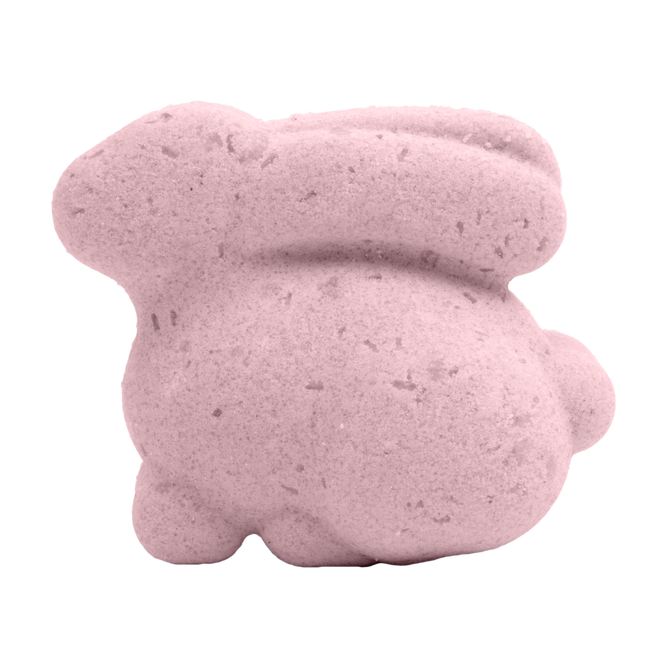 The Pacha Soap Co. Bunny Bath Bomb, pink and bunny-shaped with a smooth, slightly speckled texture, is displayed against a plain white background.