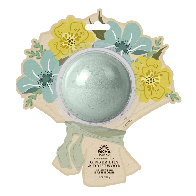 A light green Pacha Soap Co. Bath Bomb Card - Ginger Lily & Driftwood in bouquet-themed packaging with yellow and blue flower illustrations. Enjoy soothing ginger lily and driftwood notes in every soak.