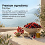 A bottle of Codeage Beef Liver Capsules - Grass-Fed rests beside fresh berries, pomegranate, wellness powders, and lush greenery on a sunlit surface with serene sea and mountains beyond—evoking the pure essence of nature’s multivitamin. The scene and text together highlight the premium ingredients and wellness benefits of this exceptional supplement.