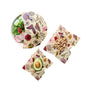 Three foods—a salad, halved avocado, and cashews—are partly wrapped in Bee's Wrap Reusable Beeswax Food Wraps (Assorted 3 Pack) with floral and butterfly designs, providing a sustainable storage option on a white background.