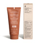 A brown tube of before Sensitive Purifying Toothpaste w/ Fluoride, Anti-Cavity and a beige box are shown. The tube lists ingredients, warnings, and directions in white text. The box notes it’s a natural toothpaste, peroxide- and paraben-free.