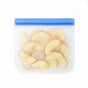 The (re)zip Flat Sandwich Bag, shown with sliced apple pieces inside and a blue seal, is a leakproof, reusable silicone zipper bag—ideal for eco-friendly food storage or as a lunch bag.