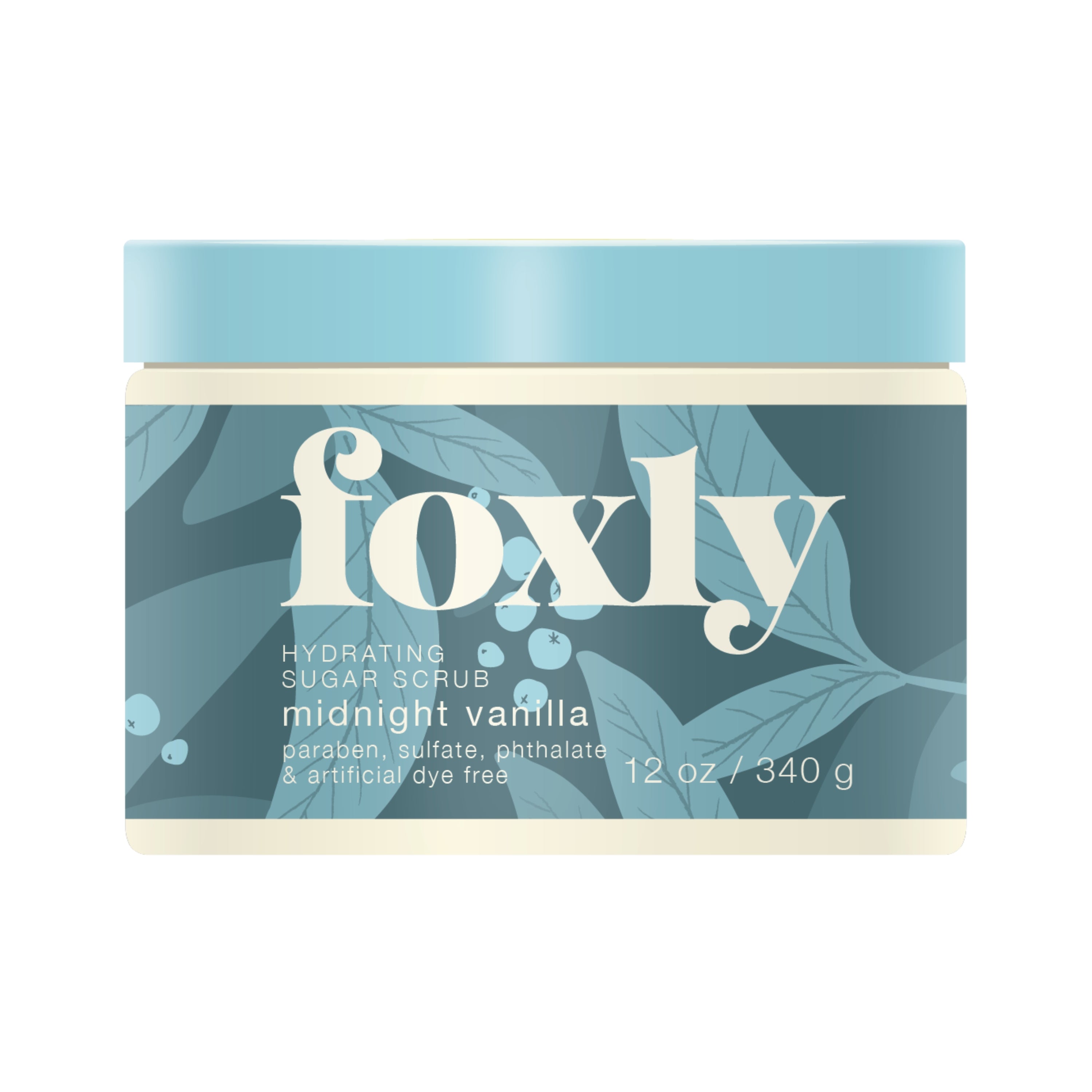 A 12 oz (340 g) jar of Foxly Body Scrub in Midnight Vanilla scent, featuring a blue floral label. The container notes it is free from parabens, sulfates, phthalates, and artificial dyes.