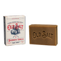 A bar of brown Old Salt Bar Soap sits beside its box, which features barrels and blue and red text on a white background. 
