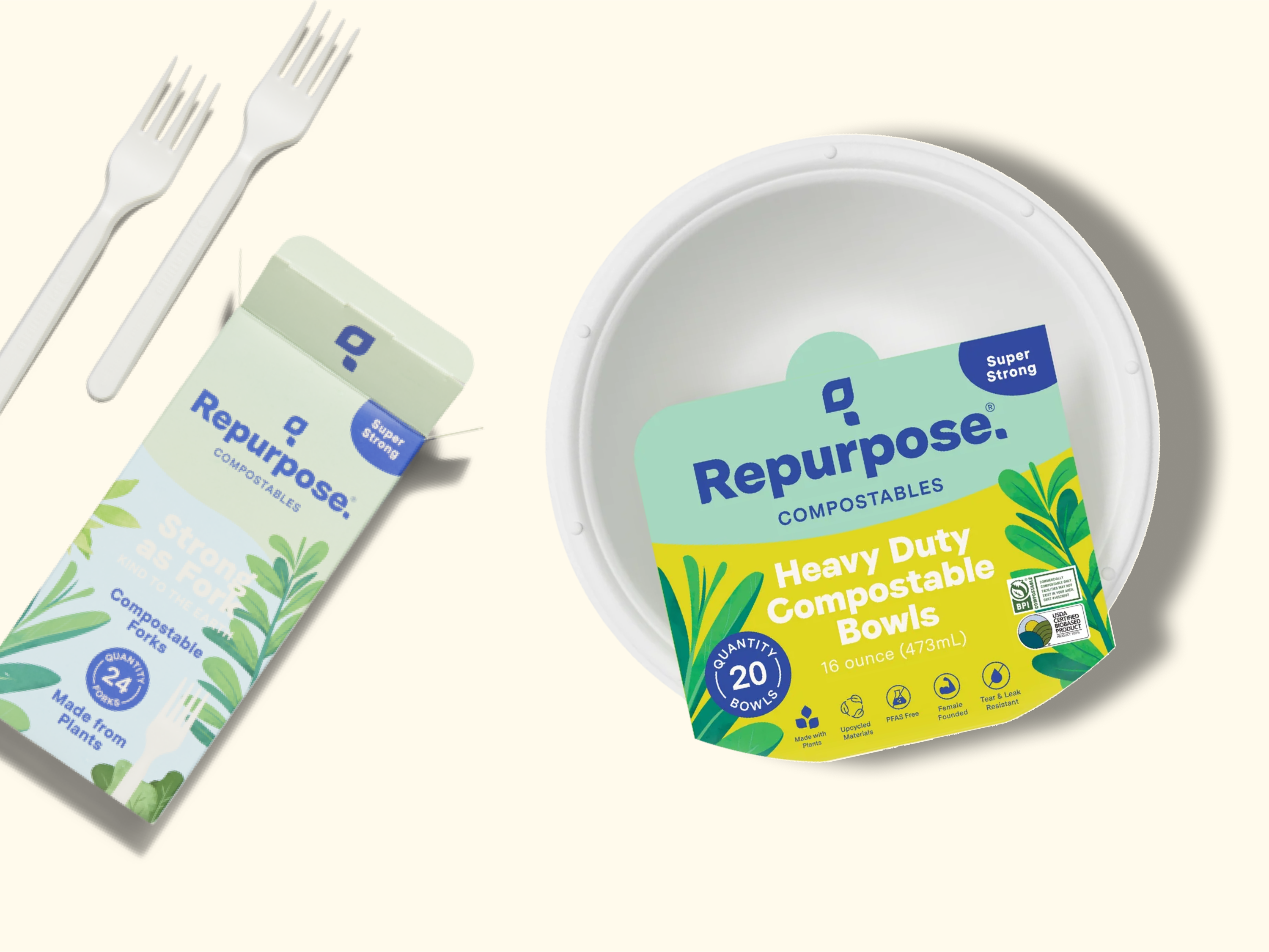 Two white compostable forks next to a box labeled Repurpose Compostables Strong Forks, and a round container labeled Repurpose Heavy Duty Compostable Bowls on a light background.