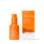 A 30 ml orange bottle and matching box of Ursa Major Brighten Up Vitamin C Serum, featuring white and yellow text and a mountain design, are shown against a white background.