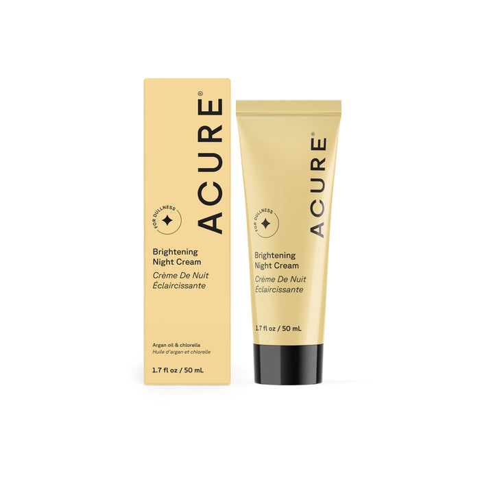 A beige tube and matching box of Acure Brightening Night Cream, each 1.7 fl oz / 50 mL, feature black text, a circular logo, English and French details, and a vegan formula designed to enhance skin radiance.