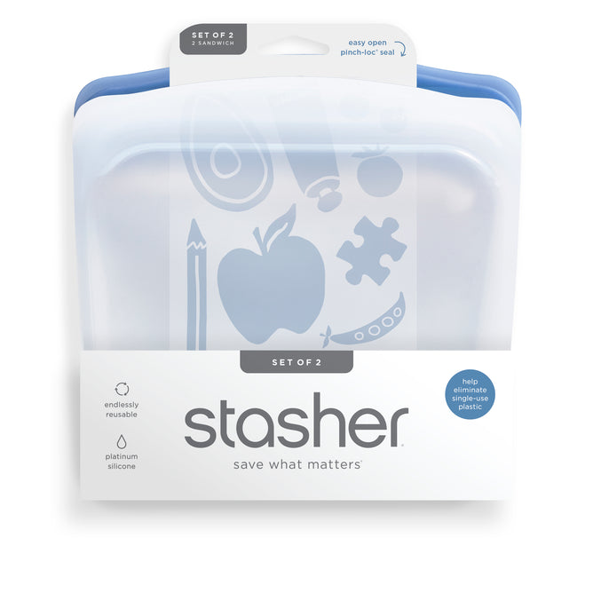 Stasher Reusable Silicone Sandwich Bag 2-pack in blue, shown in packaging with apple, pencil, and puzzle icons. Label notes “set of 2,” dishwasher safe design, easy open seal, and reduces single-use plastic.
