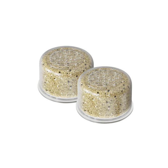 Two Canopy Showerhead Filter capsules (2 pack) are shown side by side on a white background, each filled with beige granules, designed to eliminate contaminants and provide effective water purification.