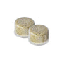 Two Canopy Showerhead Filter capsules (2 pack) are shown side by side on a white background, each filled with beige granules, designed to eliminate contaminants and provide effective water purification.
