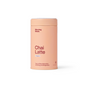 A peach cylindrical container labeled "Chai Latte - Original, 60 servings" by Morning Made, a coffee alternative with traditional tea roots supporting energy and digestion, sits against a white background.