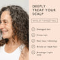 Smiling woman with curly, graying hair on the left; text on the right reads, “Deeply treat your scalp” and highlights benefits of UpCircle Scalp + Hair Oil with Bacuri Butter and Castor Oil: addresses damaged, frizzy, thinning, brittle hair, and split ends—all to promote healthy hair growth using natural ingredients.