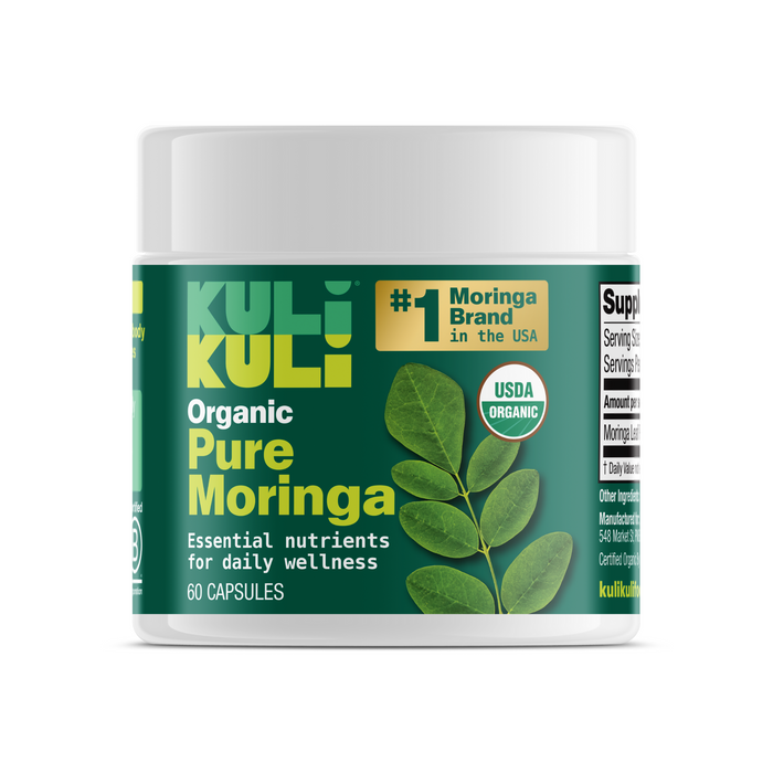 Kuli Kuli Foods Organic Pure Moringa Capsules come in a green-labeled container featuring moringa leaves and USDA Organic and America’s #1 Moringa Brand badges. Each bottle contains 60 capsules made with organic moringa leaf powder.