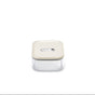 The Caraway Glass Small Container, 1 qt, is centered on a white background. It has a cream lid, is made from non-toxic glass, and features an airtight seal with a rectangular button for secure storage.