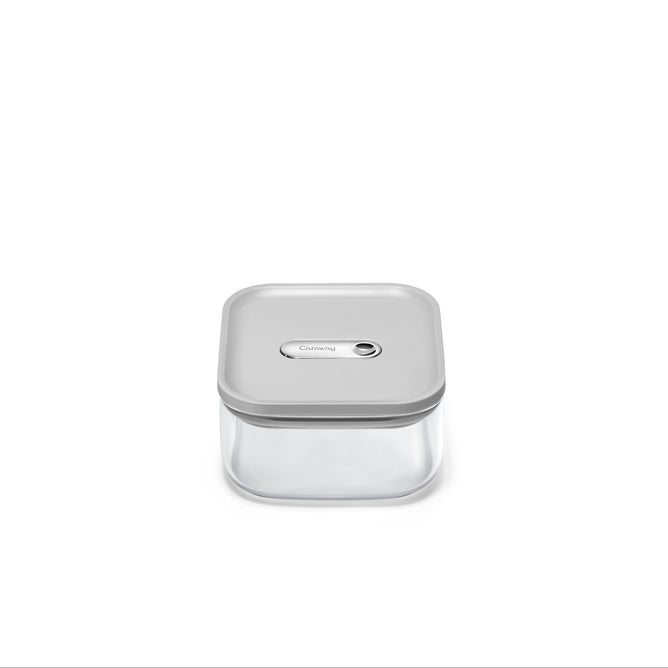 The Caraway Glass Small Container, 1 qt, made from non-toxic glass with a light gray airtight lid, is centered on a plain white background.
