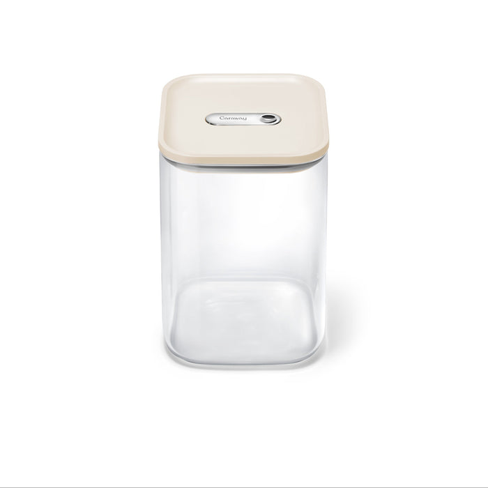 The Caraway Glass Large Container, 4 qt, features a transparent square design with a beige airtight lid and central button, shown on a plain white background.
