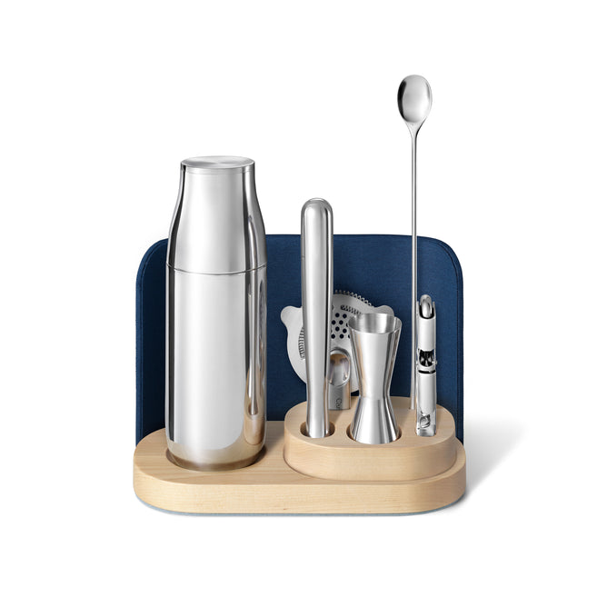 Upgrade your home bar with the Caraway Stainless Steel Complete Bar Set, 9-pc, featuring essential sleek silver tools and a wooden base for a stylish touch.