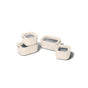 Four cream-colored Caraway Mini Food Storage containers with clear lids and gray labeled rectangles, two stacked, grouped on a white background—perfect for kitchen organization.