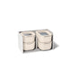 Caraway’s Mini Food Storage Set with Organizer includes four beige non-toxic containers with clear lids, stylishly arranged in a gray box—perfect for simple kitchen organization.