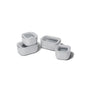 Four white, non-toxic Caraway Mini Food Storage Set with Organizer containers, each with a clear lid, are shown stacked and individually placed—providing an ideal kitchen organization solution on a white background.