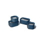 The Caraway Mini Food Storage Set with Organizer features four blue rectangular and square containers with transparent, non-toxic lids arranged for easy kitchen organization on a white background. Two are stacked; two sit side by side.