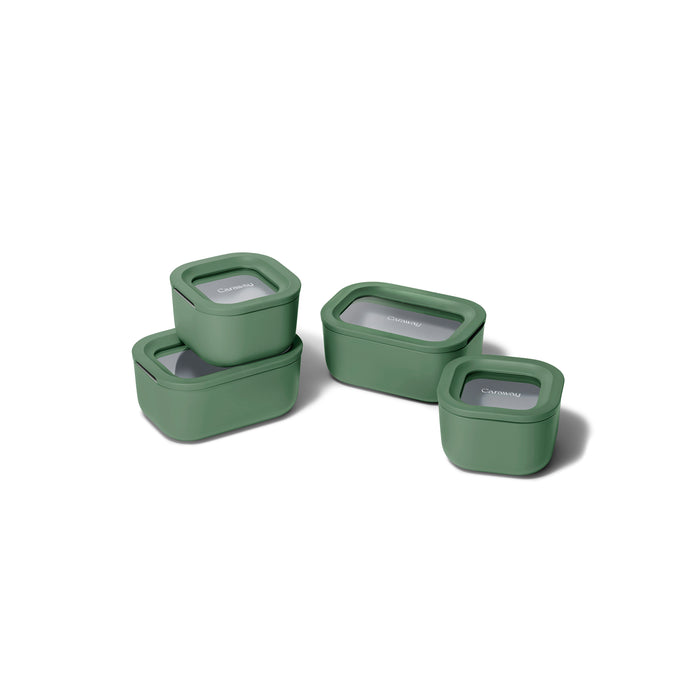 Four green rectangular Caraway Mini Food Storage Set with Organizer containers, all non-toxic and topped with transparent lids, are arranged on a white background—three stacked, one separate—for easy kitchen organization.
