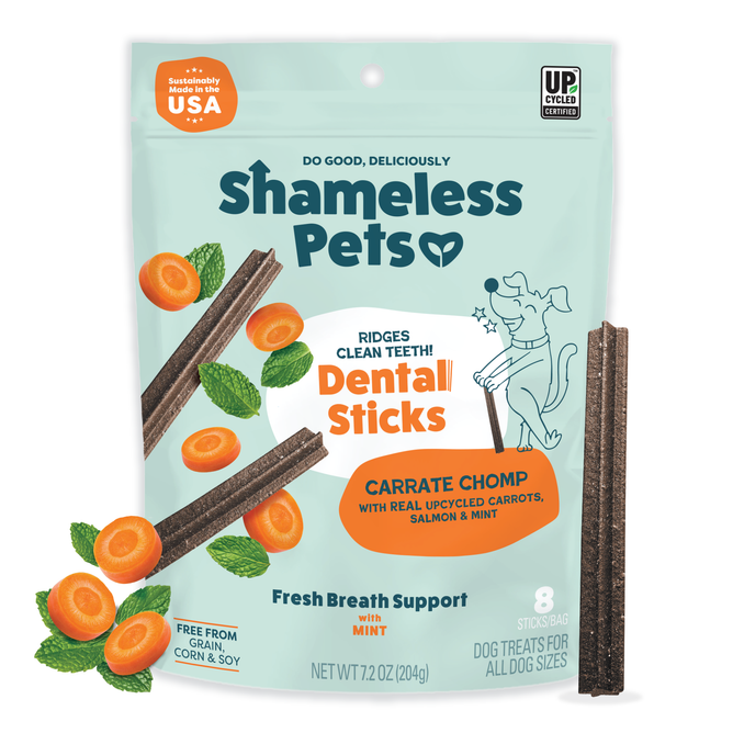 A bag of Shameless Pets Carrate Chomp Dental Sticks shows dental chews, carrot slices, and mint leaves on the packaging, which highlights teeth cleaning, fresh breath support, and a commitment to sustainability.