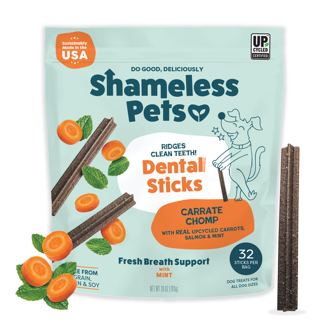 A bag of Shameless Pets Carrate Chomp Dental Sticks with carrot slices and two brown dental chews. The packaging highlights upcycled ingredients, mint, and contains 32 teeth-cleaning treats for dogs.