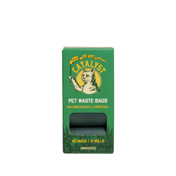 A green Catalyst Pet Compostable Pet Waste Bags box with a cat illustration, labeled 100% biodegradable & compostable, contains 60 unscented bags (4 rolls) for odor control; one roll is partly visible through a cutout.