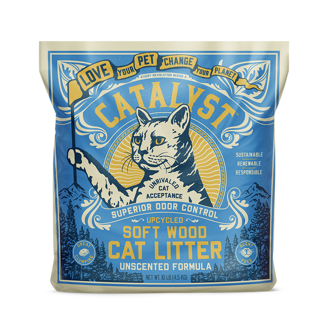 A blue and yellow bag of Catalyst Pet Upcycled Natural Pine Clumping Cat Litter, Unscented, featuring an illustrated cat, mountains, sunburst, and text promoting natural odor control and sustainability.