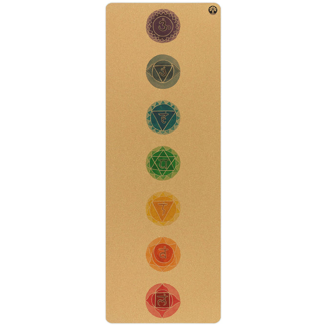 The Chakras Aura Cork Yoga Mat by Yoloha Yoga is a tan, cushioned yoga mat with a cork surface that displays seven colored chakra symbols arranged vertically down the center, each symbol representing a different energy center in the body.