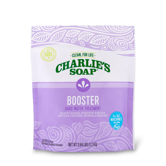 Charlie's Soap Laundry Booster & Hard Water Treatment Powder comes in a 2.64 lb (1.2 kg) bag with a purple and white leaf-patterned design, highlighting stain removal, whitening, and powerful laundry boosting benefits.