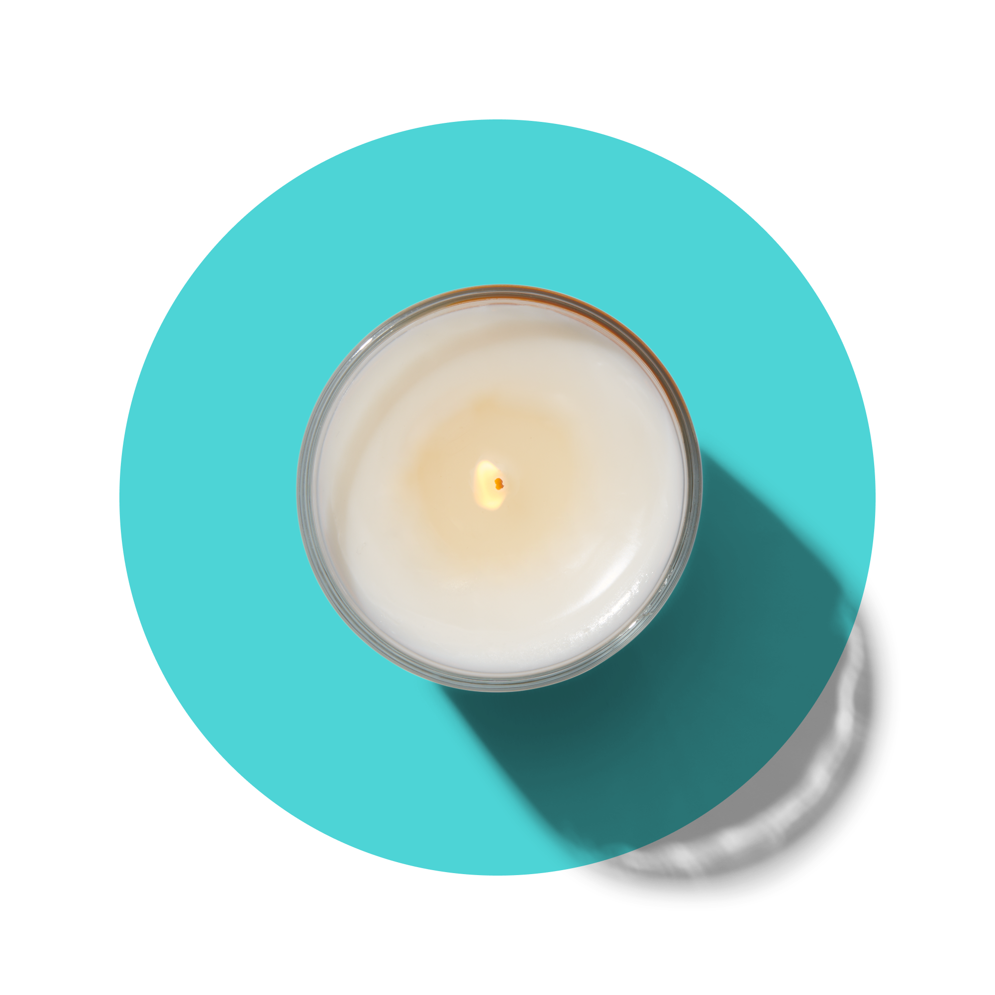 A lit white candle in a glass container viewed from above, casting a long shadow on a bright turquoise circular background.