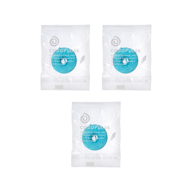 Three Cocofloss Refill Trio packs by COCOLAB, each with visible blue floss inside clear plastic, are arranged in a triangle on a white background.
