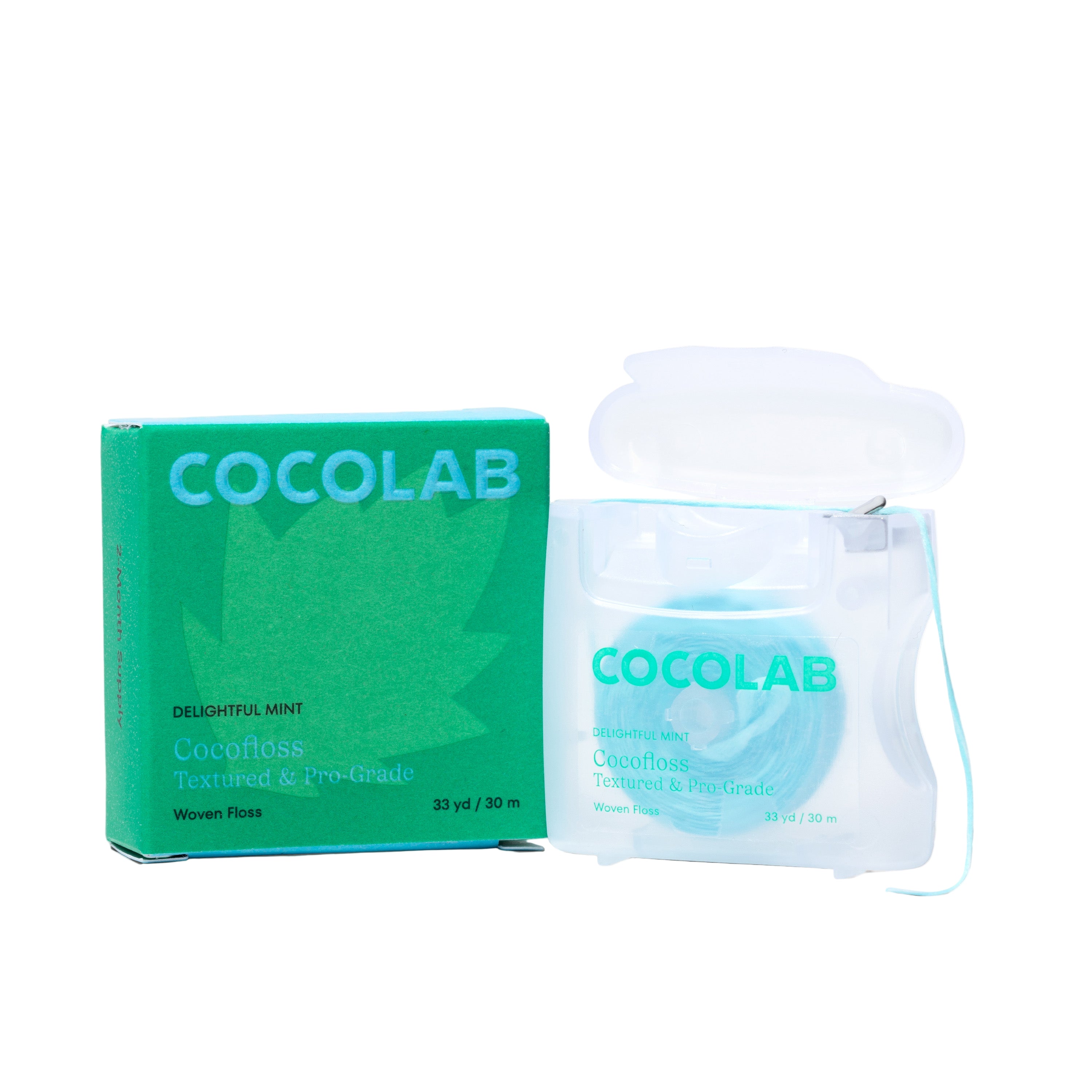 A clear dispenser and green box of COCOLAB Dental Floss in Delightful Mint are shown. The eco-friendly, light blue floss features a large leaf graphic on the box and highlights effective plaque removal.