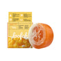 A round, orange Soapymania Mango Coconut Sorbet Exfoliating Loofah Bar Soap sits beside yellow packaging labeled loofah, which highlights coconut oil and its exfoliating, nourishing benefits.
