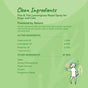 A green-themed label for kin+kinds Pet Flea & Tick Protect Spray for Dogs features USDA organic cedarwood, lemongrass, and rosemary oils. A cartoon figure holding a flower is on the right side.