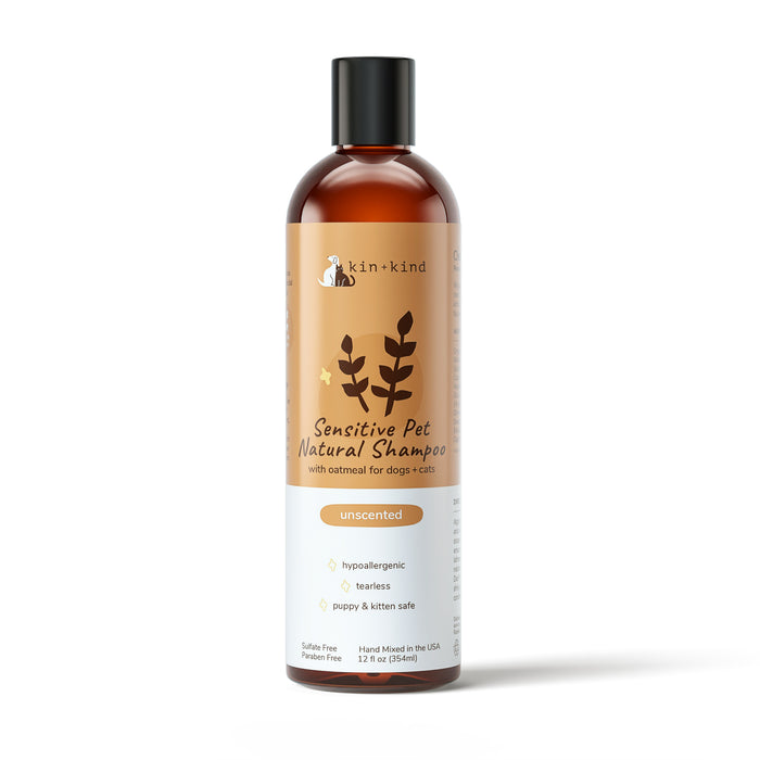 The Sensitive Skin Shampoo by kin+kind, in a brown and white 12 fl oz (354 ml) bottle, is a hypoallergenic oatmeal formula designed for dogs and cats. Vet-formulated to be tearless, unscented, and safe for puppies and kittens.