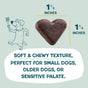 A 1.5x1.5 heart-shaped, dark brown Shameless Pets Bananas for Bacon Soft-Baked Dog Treat sits by a cartoon dog with a fork. Below, text highlights these natural treats as soft, chewy, and ideal for small or sensitive dogs.