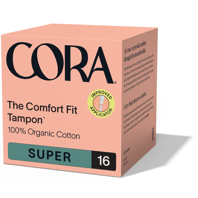 A box of Cora The Comfort Fit Tampon with Applicator – 100% Organic Cotton, labeled “Super” absorbency with 16 tampons, features a peach design, black text, and a green “Improved Compact Applicator” sticker for leak protection.