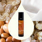 A roll-on bottle of Plant Therapy Facial Oil Roll-On - Wrinkle Eraser is centered over a teardrop background, surrounded by images of frankincense resin, argan nuts, and creamy lotion—perfect for anyone seeking anti-aging benefits and deep skin hydration.