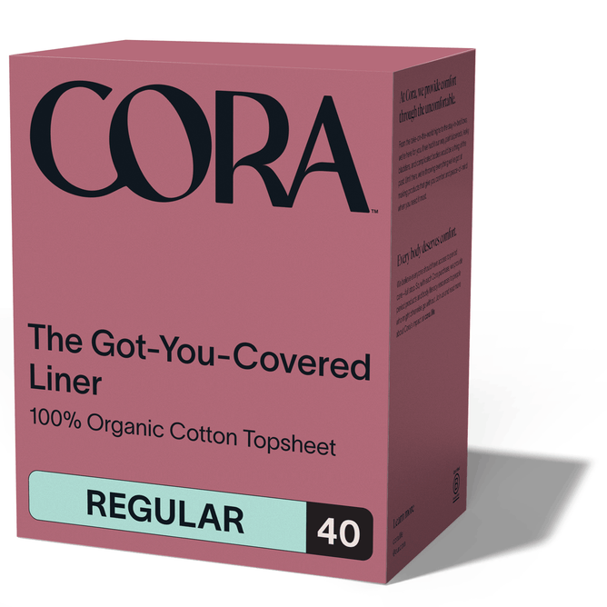 A pink box labeled Cora Got-You-Covered Pantyliners – Light Absorbency, featuring black and teal text, highlights these breathable liners designed for everyday comfort.
