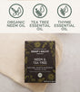 A box of Chagrin Valley Soap & Salve Natural Shampoo and Soap Bar rests on a textured cloth, while icons highlight organic tea tree benefits, neem oil properties, and Ayurvedic skin care ingredients.